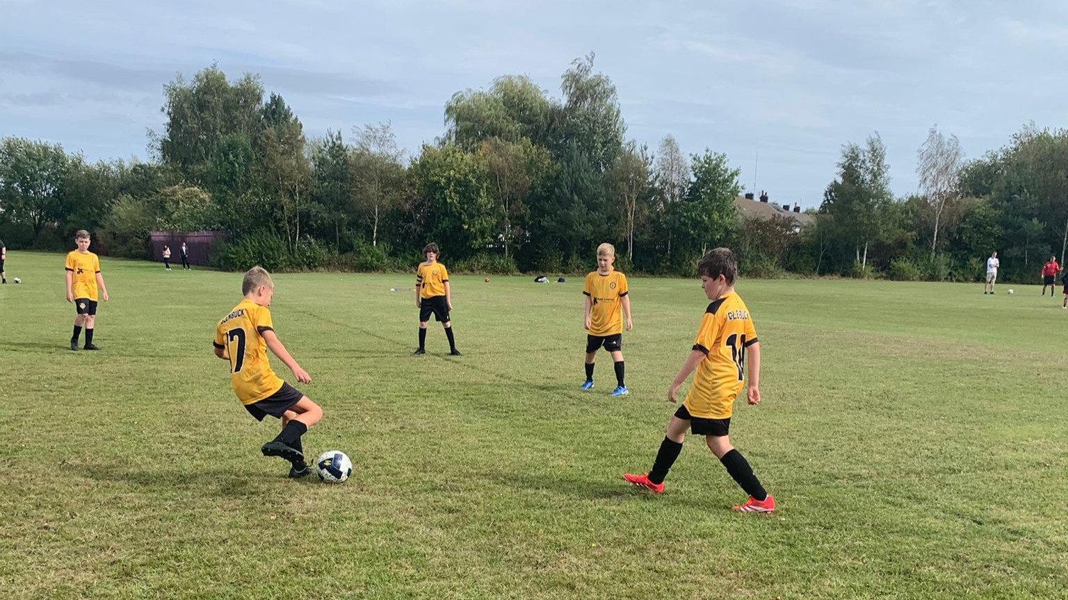 Players  training in a group in the new kit